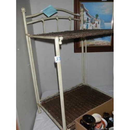 238 - A metal and Raffia shelf unit, COLLECT ONLY.