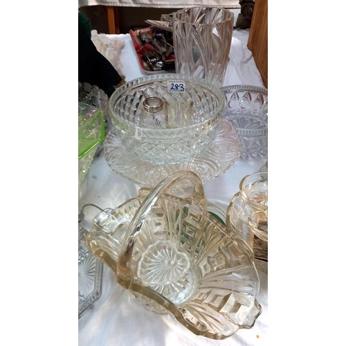 283 - A large lot of glass bowls, a cake stand & vase etc.