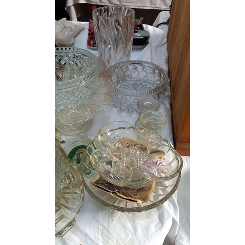 283 - A large lot of glass bowls, a cake stand & vase etc.