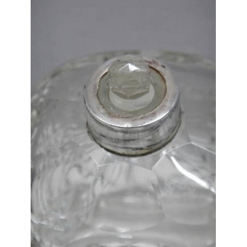 1047 - A hobnail cut glass bottle with silver top embosses with two heads.