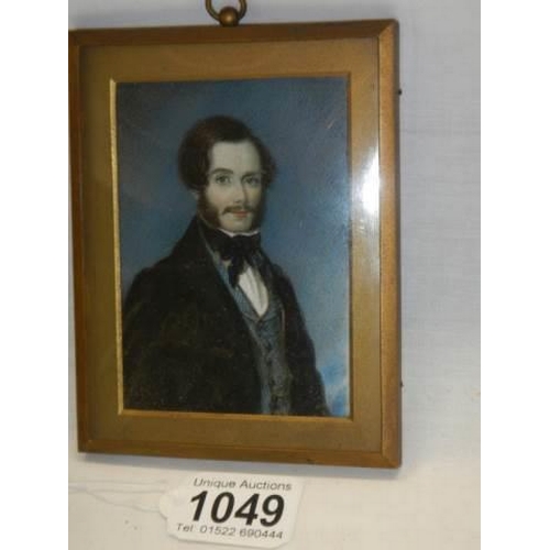 1049 - A hand painted portrait of a Victorian gentleman on ivorex.