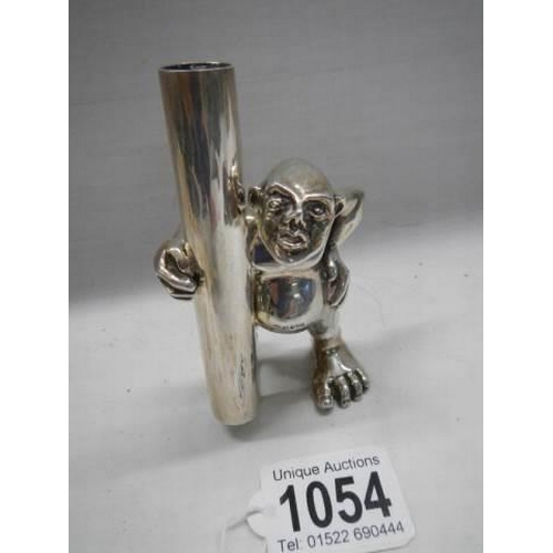 1054 - A solid silver figural specimen vase, 10.5 cm tall.