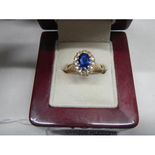 1073 - A blue and white stone 9ct gold ring,