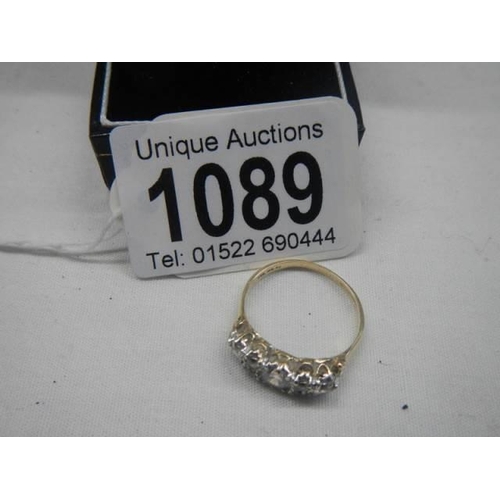 1089 - A silver gilt five stone ring,