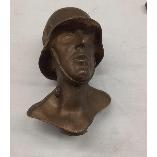 1119 - A bronze bust of a German SS soldier and a white metal eagle plaque