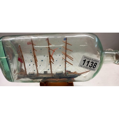 1138 - A vintage ship in bottle of a cutter circa 1700