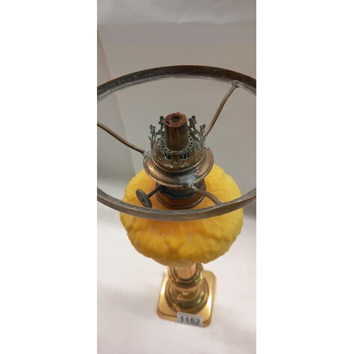 1152 - A Victorian peg font oil lamp on brass candlestick