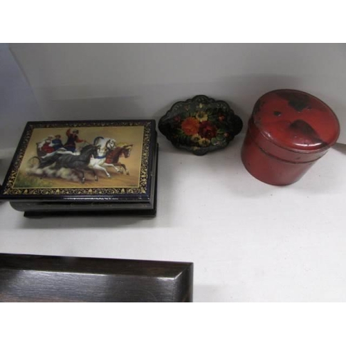 1165 - A Russian Lacquered snuff box, three other boxes and a lacquered blotter.