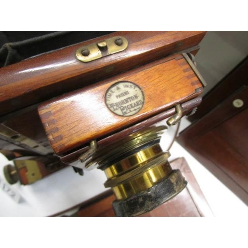 1172 - A good late Victorian wood and brass plate camera by Thornton Pickard with spare plates.