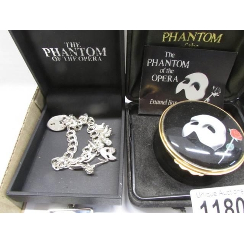 1180 - A silver Phantom mask necklace, enamel box, charm bracelet, pin badges etc.,