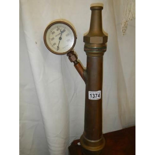 1374 - A brass fire hose nozzle with pressure gauge.