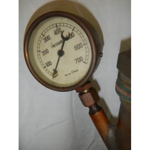 1374 - A brass fire hose nozzle with pressure gauge.