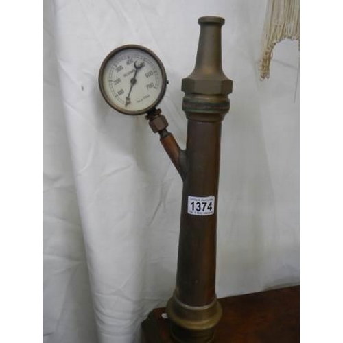 1374 - A brass fire hose nozzle with pressure gauge.