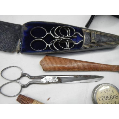 1156 - A good lot of needlework items including tape measures, scissors etc.,