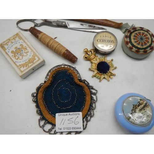 1156 - A good lot of needlework items including tape measures, scissors etc.,