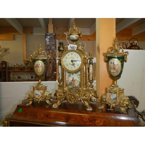 1483 - A superb three piece clock garniture with sevres panes, in working order, with key COLLECT ONLY.