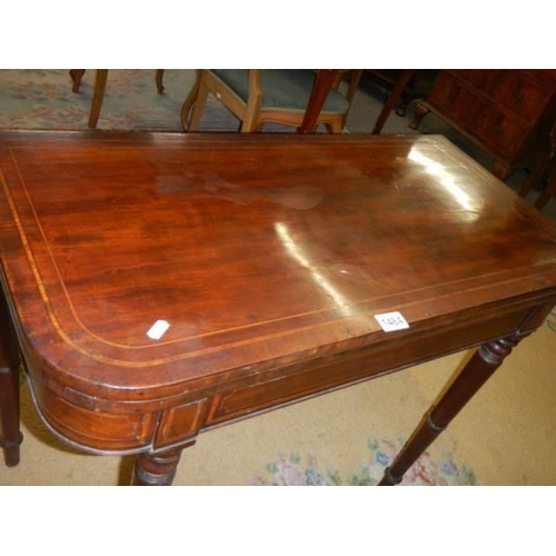 1484 - A mahogany fold over games table, COLLECT ONLY.