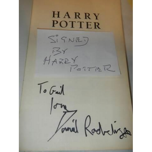 1190L - A copy of Harry Potter and the Prisoner of Askaban signed by Daniel Radcliffe.