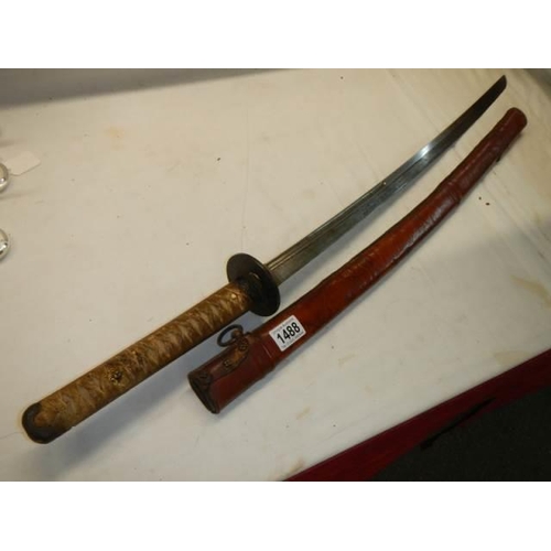 1488 - A Japanese Officers Katana sword  with shagreen hilt and leather scabbard, no marking on hilt, in go... 