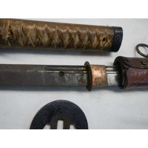 1488 - A Japanese Officers Katana sword  with shagreen hilt and leather scabbard, no marking on hilt, in go... 