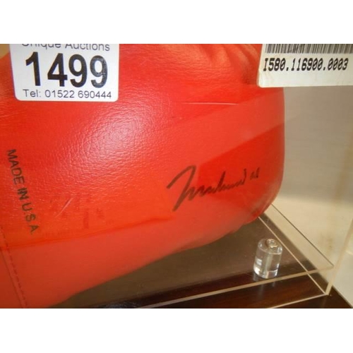 1499 - A cased signed Mohamed Ali boxing glove, COLLECT ONLY.