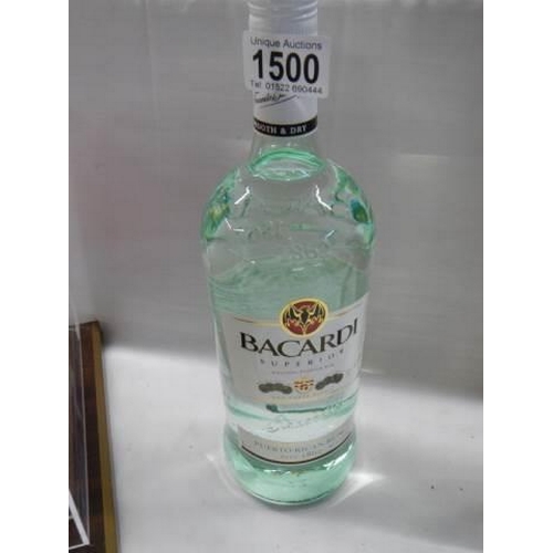 1500 - A bottle of Bacardi, a gift from J Bacardi and signed by him.