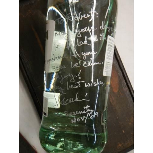 1500 - A bottle of Bacardi, a gift from J Bacardi and signed by him.