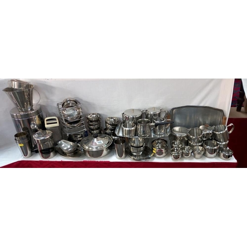 102 - A large lot of stainless steel kitchen ware