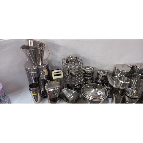 102 - A large lot of stainless steel kitchen ware