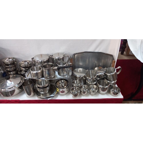 102 - A large lot of stainless steel kitchen ware