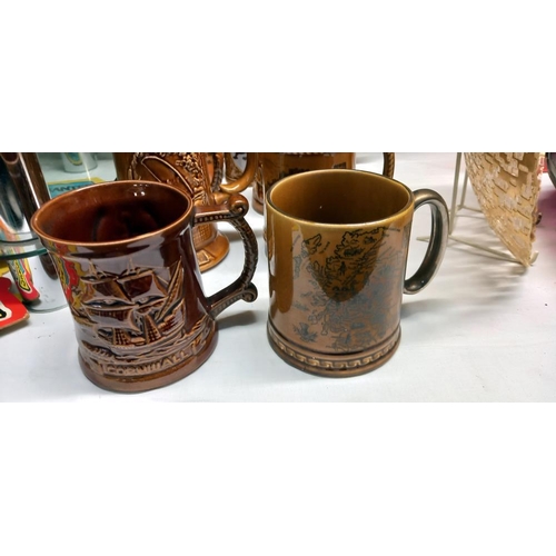 28 - A quantity of assorted tankards