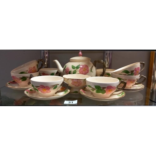 31 - A floral pottery tea set