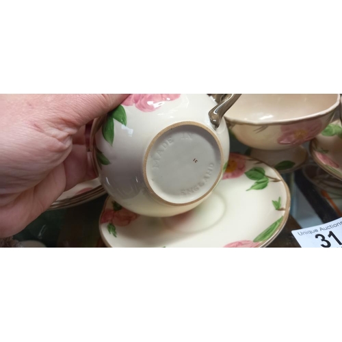 31 - A floral pottery tea set