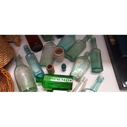 58 - A quantity of 19/20c vintage glass bottles including green poison etc