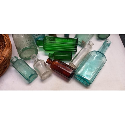 58 - A quantity of 19/20c vintage glass bottles including green poison etc