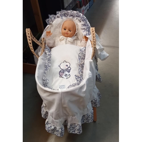 69 - A doll in a Moses basket, COLLECT ONLY.