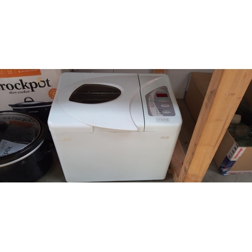 78 - A bread maker, crock pot and portable gas stove