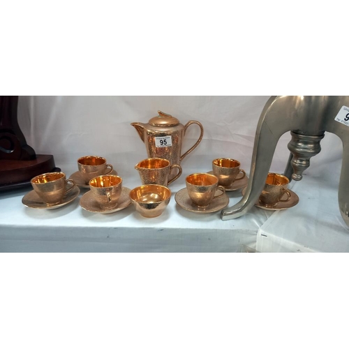 95 - A Jersey pottery gilded coffee set. COLLECT ONLY