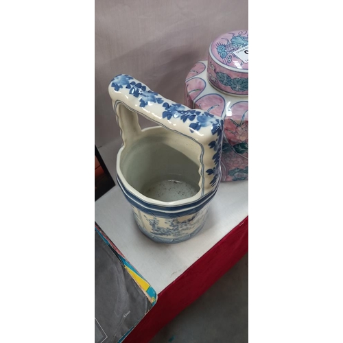 96 - A pottery lidded jar and a blue and white china pail/bucket