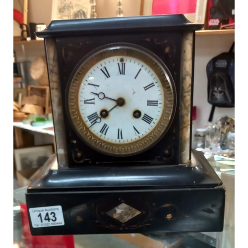 143 - An Edwardian black slate mantle clock