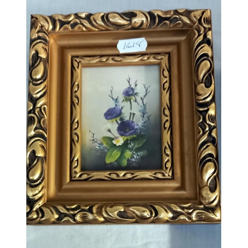 208 - A pair of small gilt framed prints of flowers