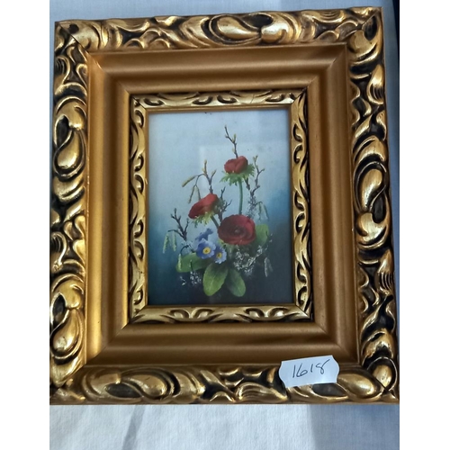 208 - A pair of small gilt framed prints of flowers