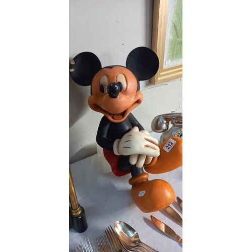 212 - A large Disney figure of a seated Mickey Mouse (slight a/f to ear)