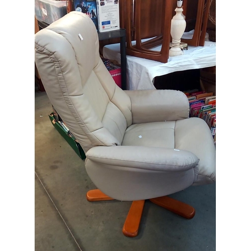 298 - A leather swivel chair in a cream colour COLLECT ONLY