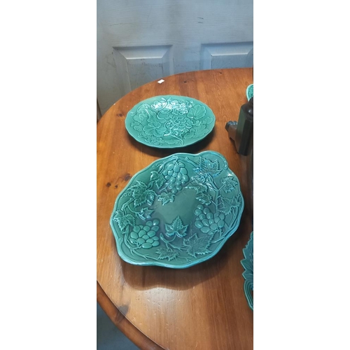 304 - A quantity of vintage green ceramic plates