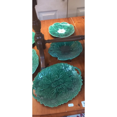 304 - A quantity of vintage green ceramic plates