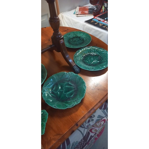 304 - A quantity of vintage green ceramic plates