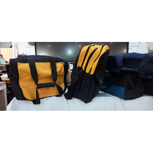 332 - A good lot of holdalls and backpacks