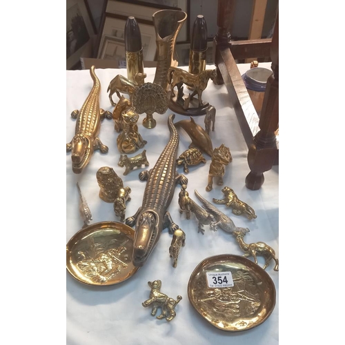 354 - A good lot of brass including 2 crocodile nut crackers and many animal figures etc