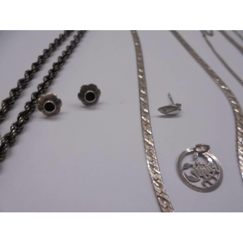 1001 - A mixed lot of silver items including necklaces, chains, charms etc.,